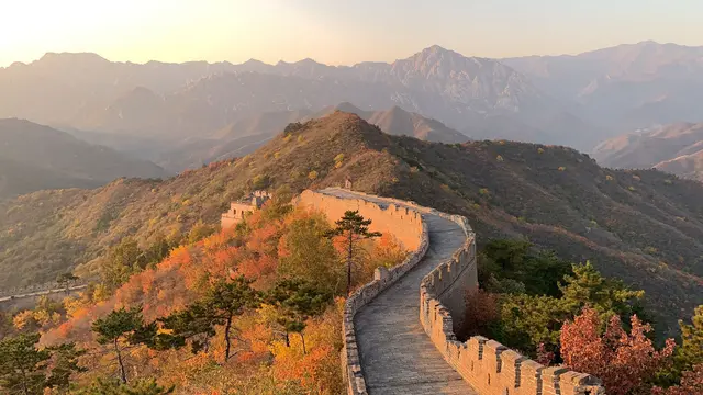 The Great Wall of China winding over hills in autumn