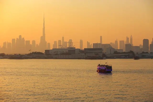 Dubai skyline across the water in golden evening light