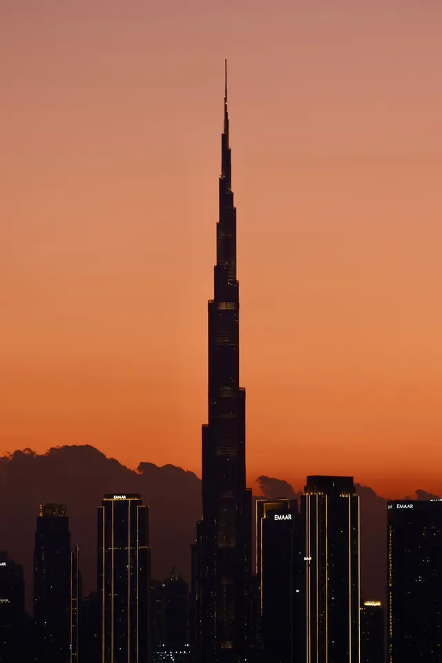 Burj Khalifa against an orange sunset sky